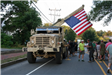 A military vehicle with a flag