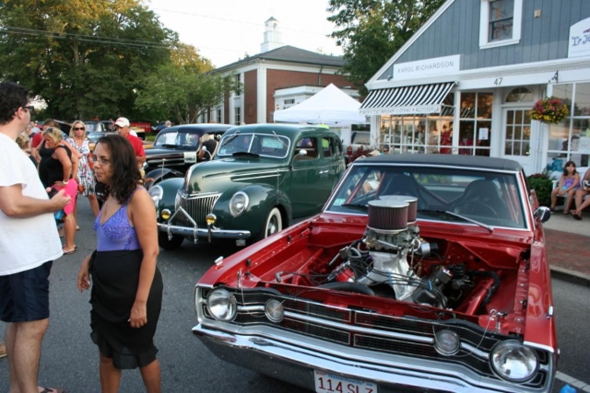 People viewing antique cars 2