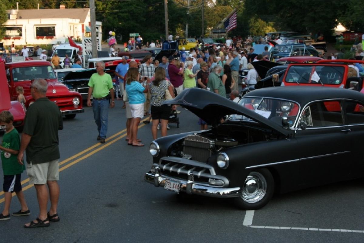 People viewing antique cars 3