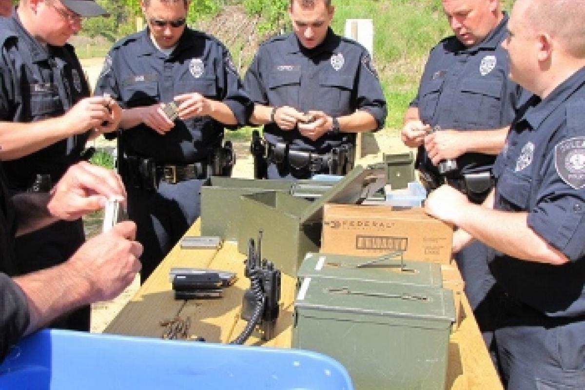 Police officers loading their weapons