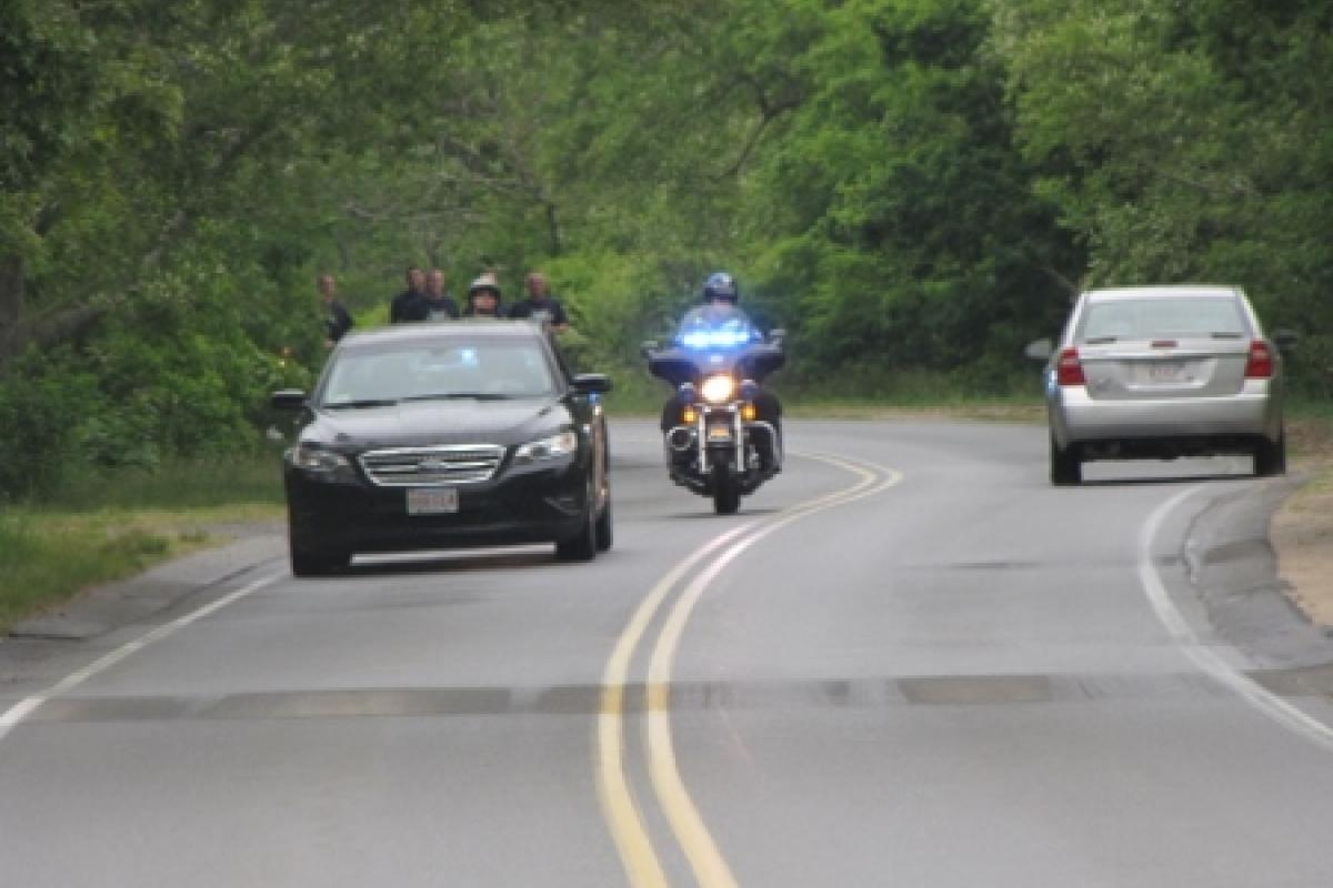 Officers running with police escort